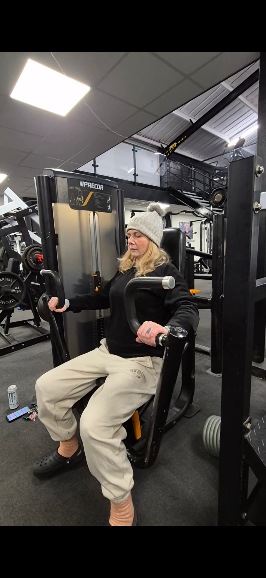 Kate working out on a chest press machine