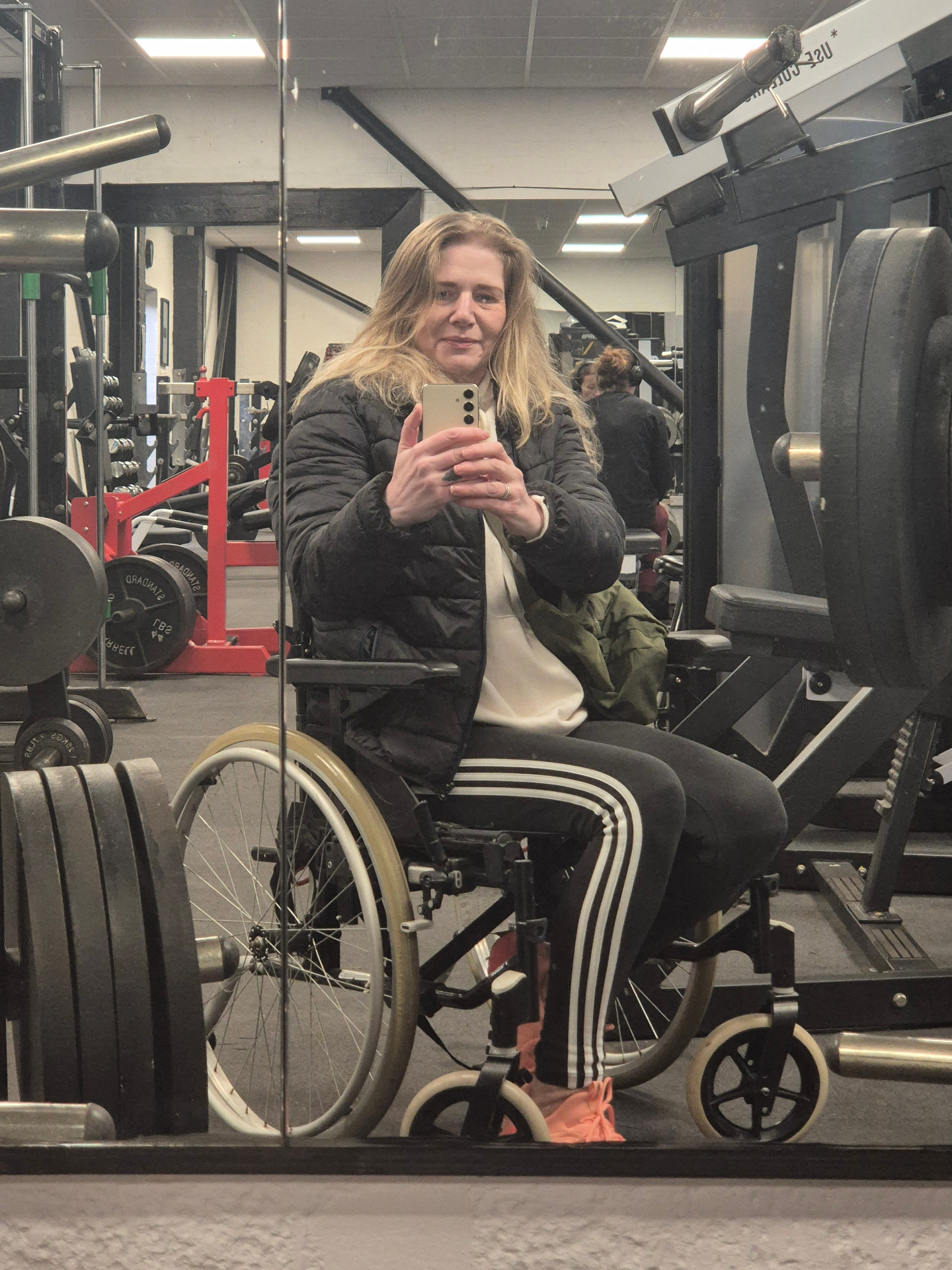 Kate training in the gym using a wheelchair
